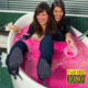 Two girls in a tub of slime